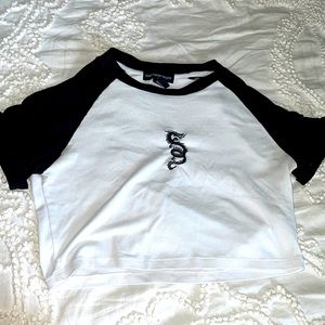 This is a white and black cropped shirt from the mall size SMALL